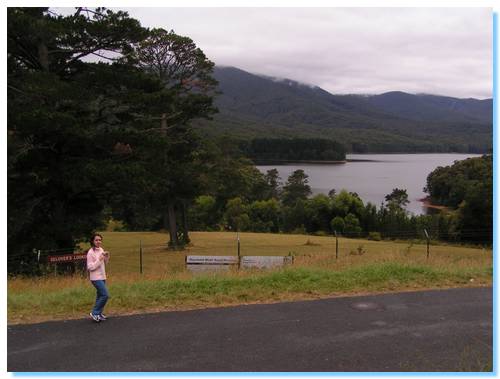 Smitha taking a photo with Maroondah Reservoir in the background